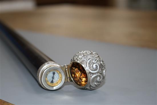 A Victorian walking stick with embossed silver pommel H.M., Birmingham 1906, opens to reveal a compass, overall length 89.5cm